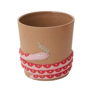 A cup with a pink ribbon around it