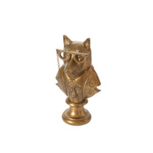 A gold owl statue with glasses on top of it.
