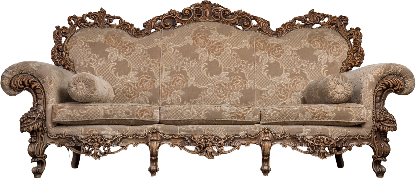 A vintage, ornately carved wooden sofa with floral-patterned upholstery and round cushions on its arms.