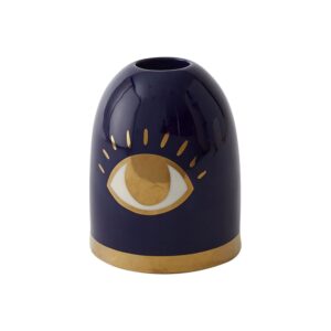 A dark blue ceramic object with a golden eye design and a gold base.