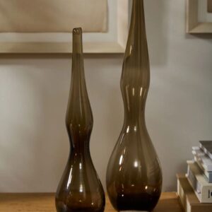Two brown vases on a table next to each other.