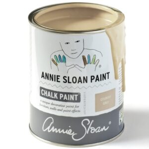 Tin of Annie Sloan chalk paint with beige paint dripping down the side.