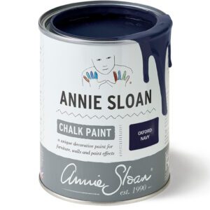 A can of Annie Sloan chalk paint in dark blue color.