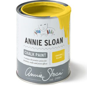 A can of Annie Sloan chalk paint in bright yellow.